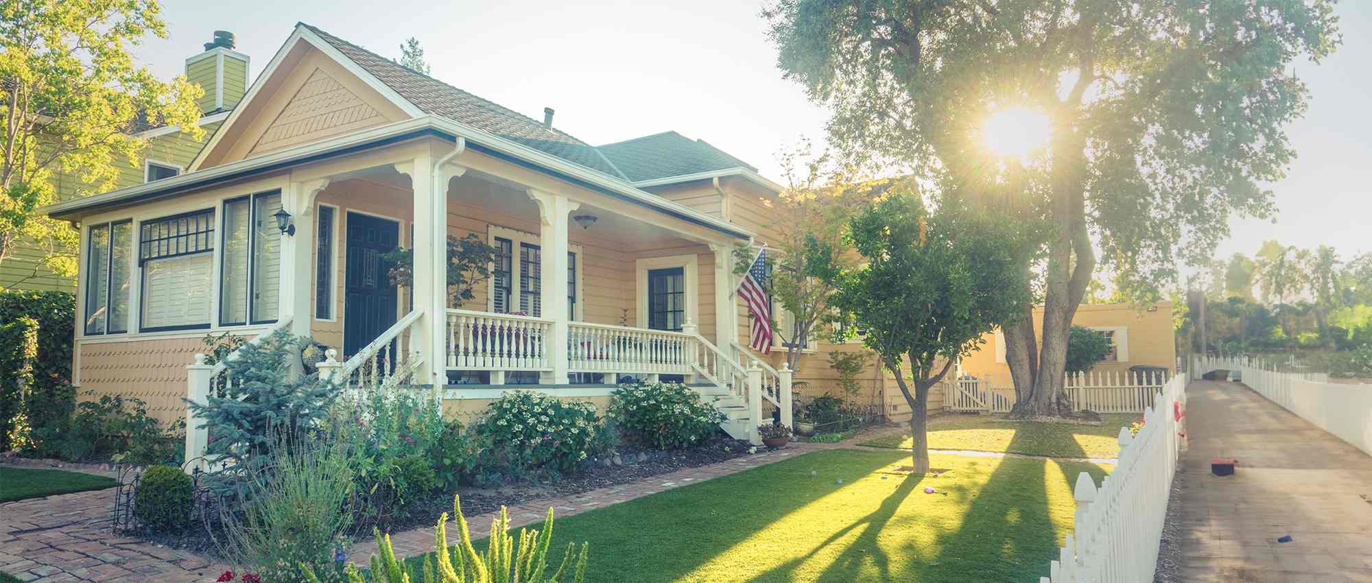 home with American flag and sunshine